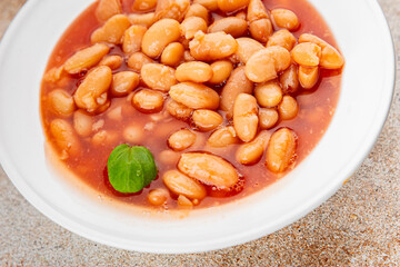 White bean tomato sauce delicious gourmet food background on the table rustic food top view copy space keto and paleo diet vegetarian and vegan food