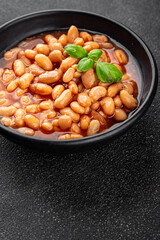 White bean tomato sauce delicious gourmet food background on the table rustic food top view copy space keto and paleo diet vegetarian and vegan food