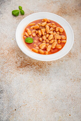 White bean tomato sauce delicious gourmet food background on the table rustic food top view copy space keto and paleo diet vegetarian and vegan food
