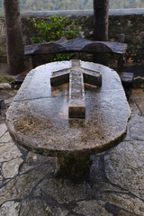 stone cross on the table