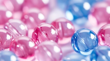 Colorful Transparent Marbles in Pink and Blue Spread Across Surface