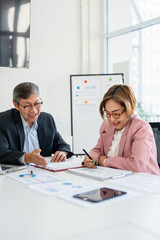 Fototapeta premium Professional executive team working at meeting in office. Older business man manager leader talking to board people consulting partners investors discussing project management in teamwork.