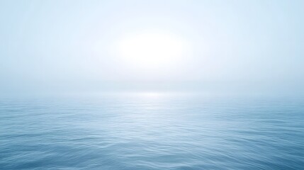 Obraz premium Calm and mysterious ocean water with foggy sky above it all