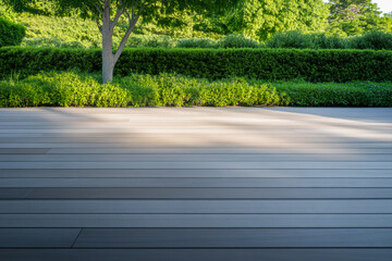 Wooden deck with green foliage and early morning sunlight in a tranquil outdoor space