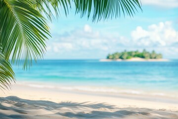 Obraz premium Tropical beach background with palm leaves and sand, a banner for a summer vacation concept. Shallow depth of field with blurred seawater in the foreground and an island on the horizon. Bright, sunny 