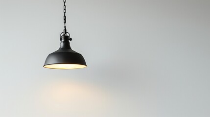 Obraz premium A stylish pendant light fixture with an industrial design, hanging against a bright white background in high-definition sharpness.