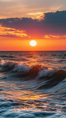 Fototapeta premium Sunset over the ocean with waves