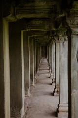 Exploring the majestic corridors of Angkor Wat in Cambodia during the early morning light