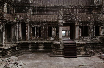 Explore the intricate architecture of Angkor Wat temple complex in Cambodia, showcasing ancient...