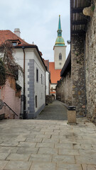 Obraz premium View of St. Martin’s Cathedral from a Historic Alleyway in Bratislava, Slovakia
