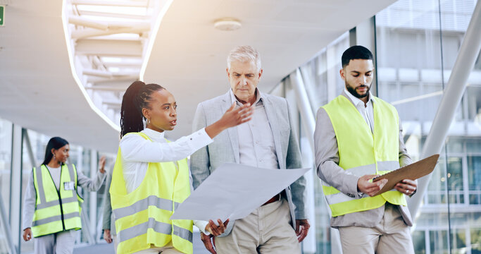 Engineer, blueprint and talk to business man for architecture, planning and analysis with presentation in hallway. CEO, women or construction worker with pointing, advice or questions for property