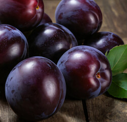 Fototapeta premium Fresh Juicy Black Plums with a Cut Half