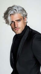 Obraz premium A man with a gray haired and a beard wearing a black suit and a black necktie