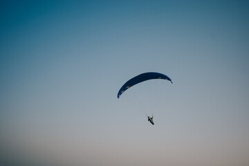 paragliding in the blue sky