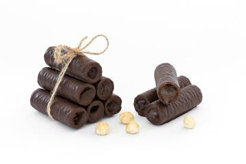 Sweet chocolate covered rolls - table arrangement, isolated on white background. Selective focus....