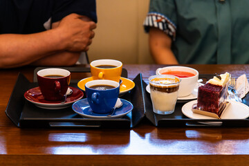 various drinks with a cake on the table
