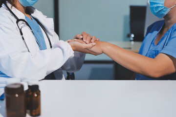 Closeup, doctor holding hands with senior woman and cancer care or support. Healthcare or trust,...