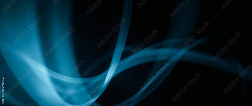 Canvas Prints abstract blue smoke creating wavy pattern on black background