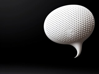 Embossed Speech Balloon Sculpture Against a Dark Studio Backdrop with Monochromatic Lighting and a Smooth Black Surface