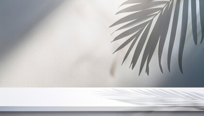 Minimalistic light background with blurred foliage shadow on white wall