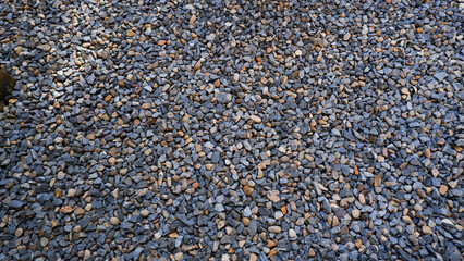 Pebble texture or pebble background for home accent. Original grunge texture background and small stones. Top view of gravel driveway on the ground