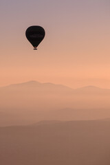 hot air balloon silhouette at sunrise