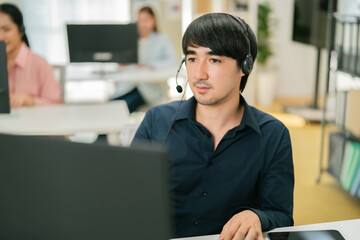 Young smiling male call center operator