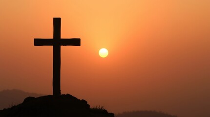 Wooden Cross Against a Fiery Sunset Sky