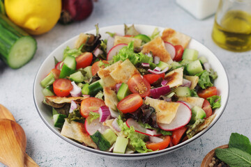 A bowl with Fattoush - Traditional Levantine salad