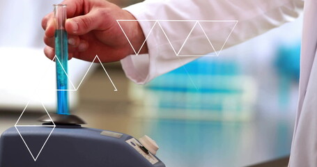 Image of white shapes over caucasian scientist with sample