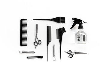 Layout of hairdresser tools set, top view. Combs and scissors on white background