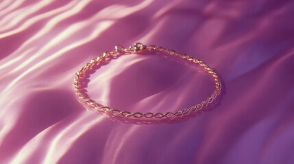 Fototapeta premium Dainty gold anklet displayed on a textured pink background