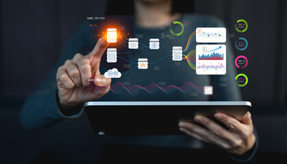 A person interacts with a digital tablet displaying various data graphics and icons, illustrating advanced digital technology and data analysis.