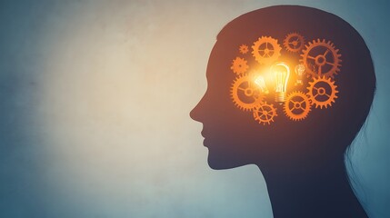 Silhouette of human head filled with gears and lightbulbs