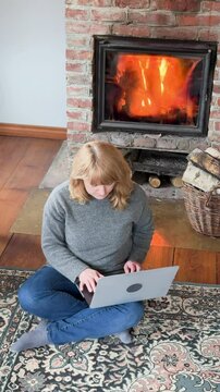 Cozily working by the fireplace on a chilly day