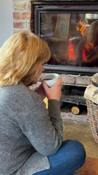 Cozy relaxation by the fireplace with a warm drink