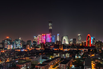 Obraz premium The style of Beijing, China, the light show of the building complex of China World Trade Center, and the charm of a modern metropolis