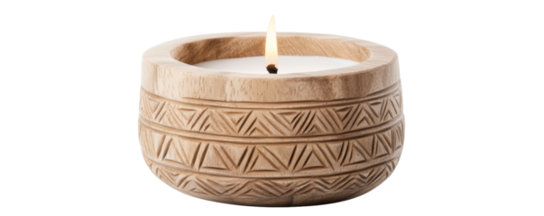 A decorative wooden candle holder. A burning candle placed in a beautifully carved wooden holder with tribal patterns, creating a warm and cozy ambiance, isolated on white.