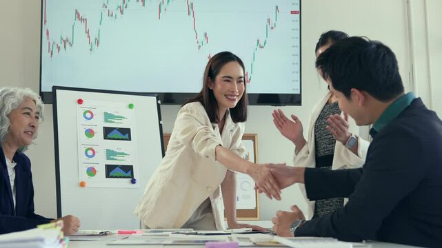 Corporate team joyfully cheering, sharing triumph during collaborative workspace gathering following successful project completion