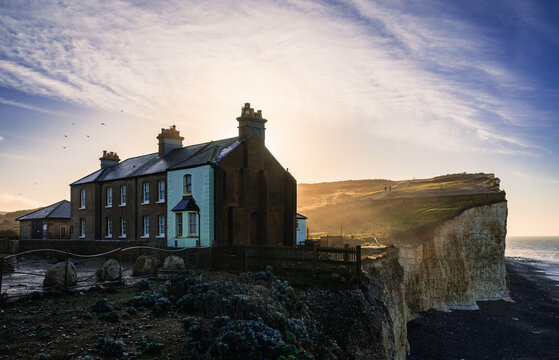 Birling gap cottages on the edge of the cliffs south downs east sussex south east England UK