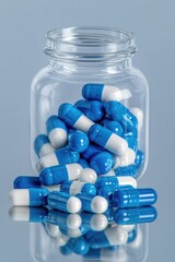 Colorful capsules spill from glass jar, showcasing vibrant blue
