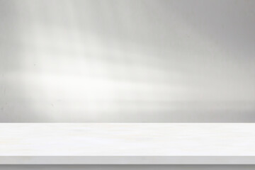 Marble table with window shadow drop on white wall background for mockup product display