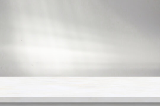 Marble table with window shadow drop on white wall background for mockup product display