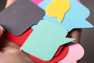 Close-up of colorful speech bubbles representing communication, ideas, and feedback.