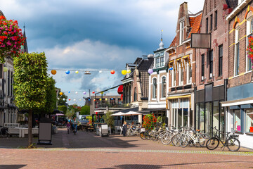 Bustling streets with cafés, shops, and urban charm in the Dutch town Heerenveen.