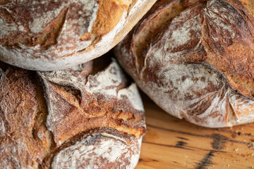 Close-up of rustic sourdough loaves, perfect for baking blogs & food websites.