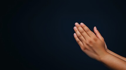 Praying hands with faith in religion and belief in God on dark background. Power of hope or love and devotion.