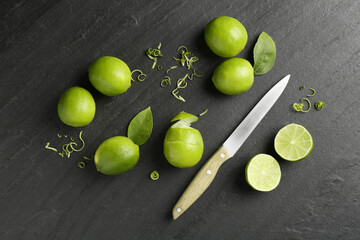 Lime zest, fresh fruits and knife on dark textured table