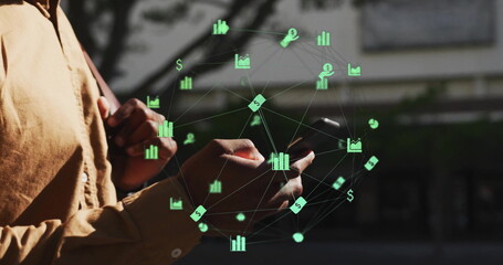 Image of network of connections with icons over biracial man using smartphone