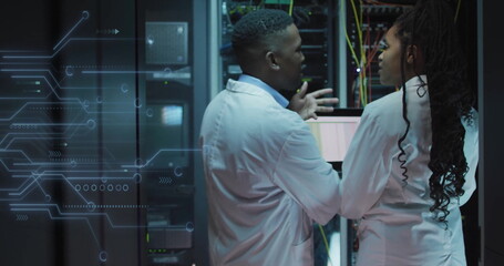 Image of data processing and african american it technicians with laptop by computer servers